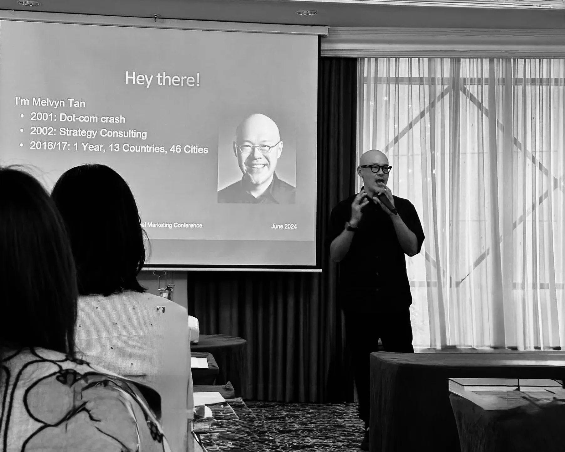 Melvyn Tan speaking at a conference